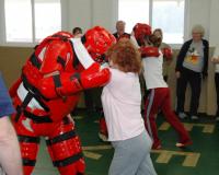 Person Practicing Self Defense with Person in Protective Gear
